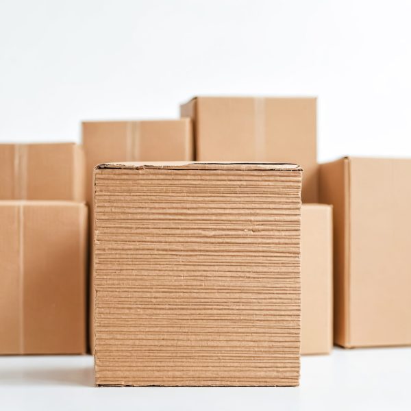Stack of cardboard boxes on a white background.